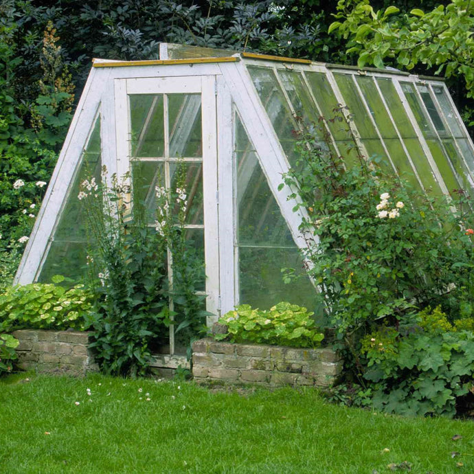 Can I build a greenhouse kit over my garden bed?